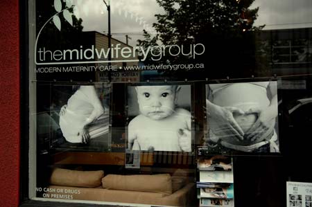 The Midwifery Group storefront baby photos